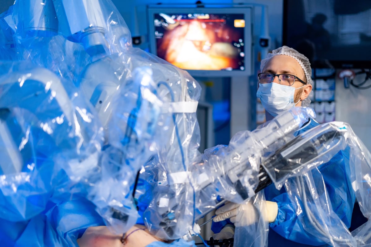 Robotic-assisted total knee replacement surgery performed with precision robotic-arm technology